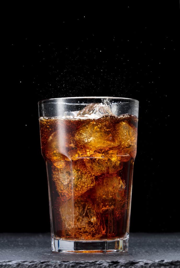 A glass of cola with ice